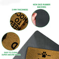 Close-up of Cane Corso doormat showing textured tan surface, black printed artwork, and dark rubber backing