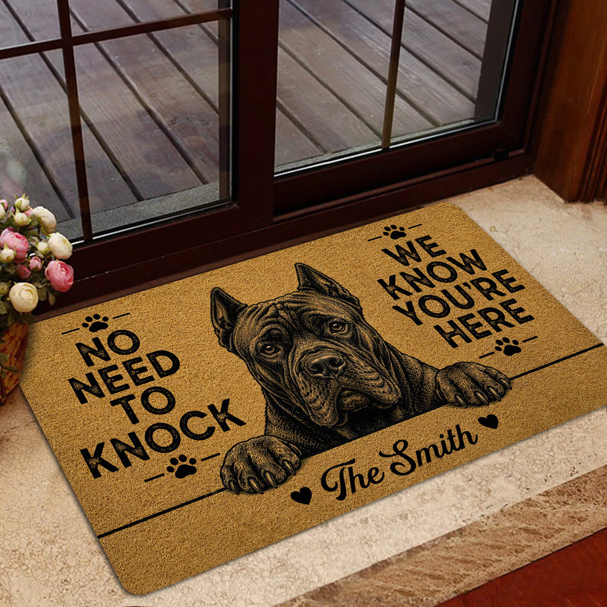 Cane Corso doormat styled at a home entrance with tan artwork, black lettering, and a detailed guard dog portrait