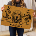 Person holding a Golden Retriever doormat featuring a friendly dog portrait, paw prints, and bold lettering