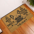 French Bulldog doormat styled in a home's entryway on hardwood flooring beside a white door