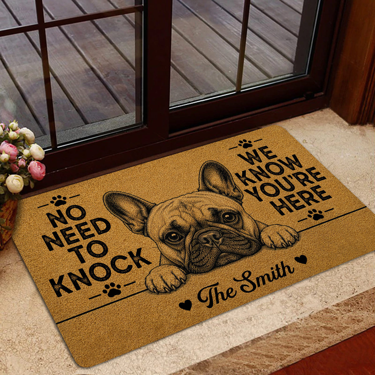 French Bulldog door mat presented at a glass entry door with a warm tan and black illustrated design