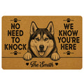Tan husky doormat with paw prints, humorous welcome message, and a family name design