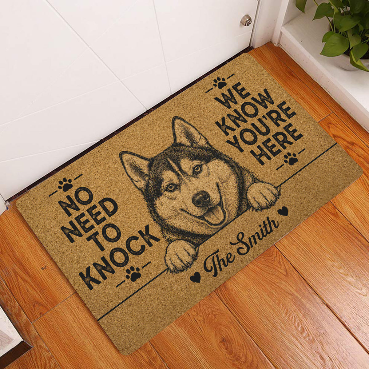 Husky welcome doormat displayed at an indoor entryway on a hardwood floor
