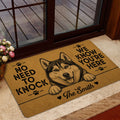 Husky entryway rug positioned near a glass door in a warm home interior