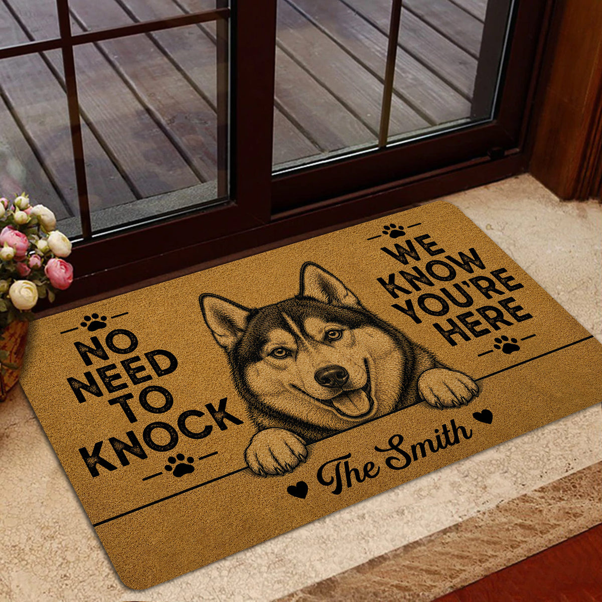 Husky entryway rug positioned near a glass door in a warm home interior