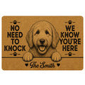 Goldendoodle doormat with a smiling dog portrait, paw prints, warm tan artwork and bold black welcome lettering