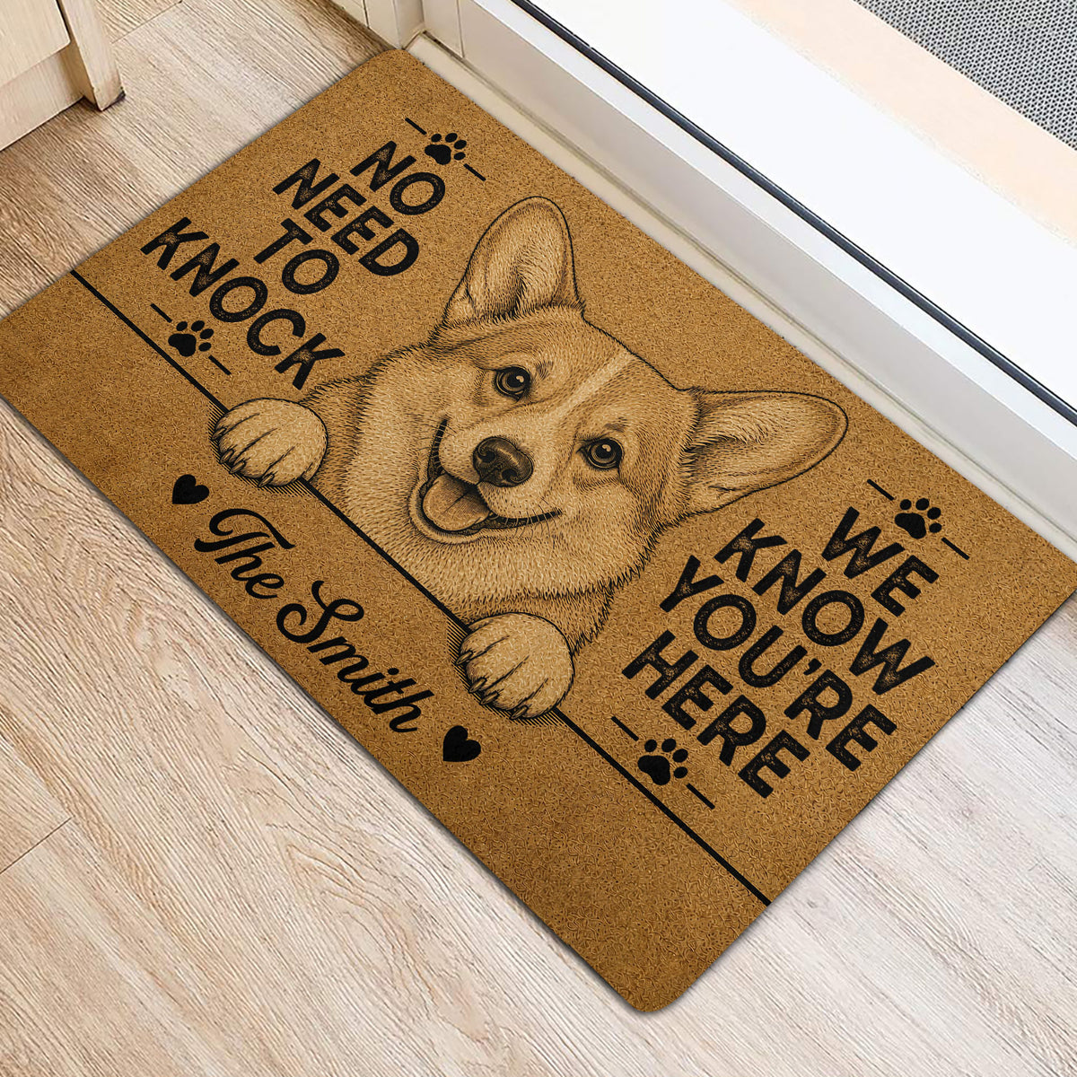 Corgi front door mat with illustrated dog, paw prints and playful lettering in a bright entryway