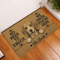 Brown beagle entryway mat displayed beside a white door on a wood floor
