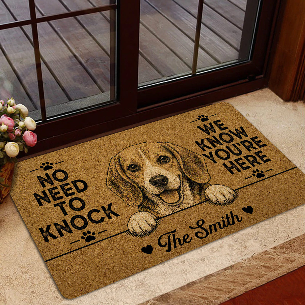 Beagle welcome doormat styled at a glass entry door with flowers nearby