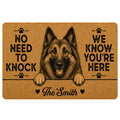 Custom family name doormat with detailed Belgian Shepherd dog illustration, upright pointed ears, friendly open mouth, tan coir-style background, paw prints and humorous No Need to Knock We Know You’re Here welcome quote.