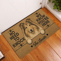 Rough Collie entryway rug displayed beside a white door on a warm wood floor