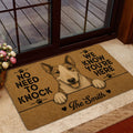 Bull Terrier welcome mat shown in a home entrance beside glass doors and a wood deck