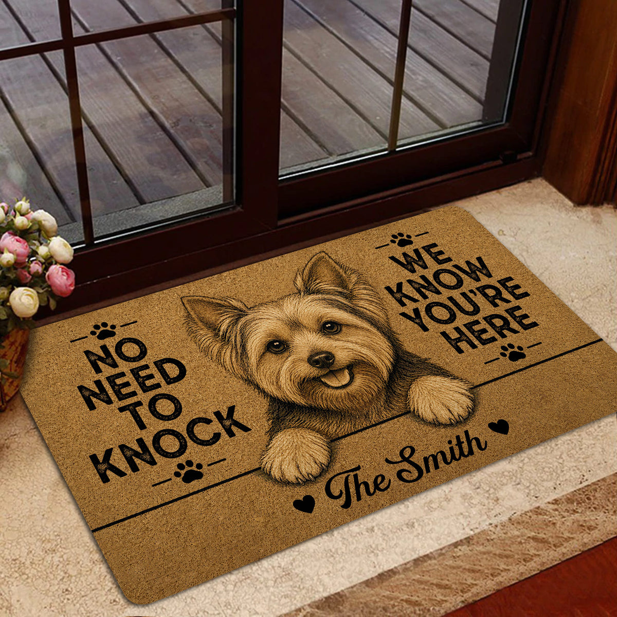 Yorkie welcome mat styled inside a glass doorway with a smiling terrier portrait and black lettering