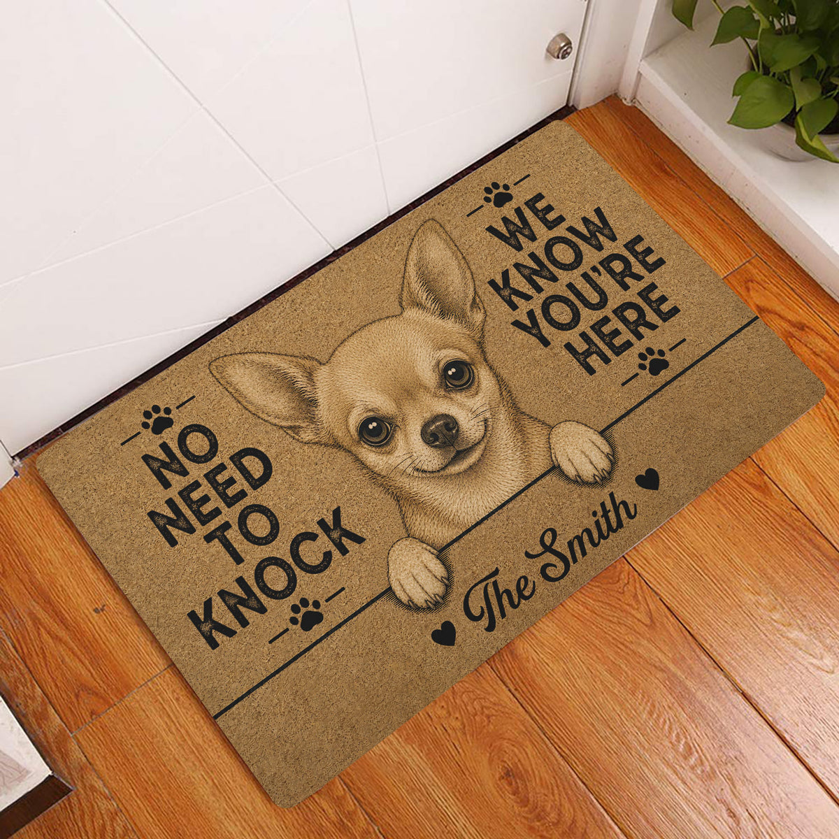 Chihuahua entryway doormat displayed beside a white door on a warm wood floor