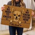 Person holding a Chihuahua doormat featuring a detailed dog portrait, paw prints, hearts, and welcome lettering