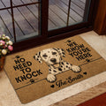 Dalmatian welcome mat displayed in a home entrance beside glass doors and flowers