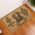 Curly Coated Retriever doormat styled at an indoor entryway beside a white door and wood flooring
