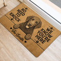 Curly Coated Retriever entryway rug displayed beside a door with a detailed dog portrait and paw print accents