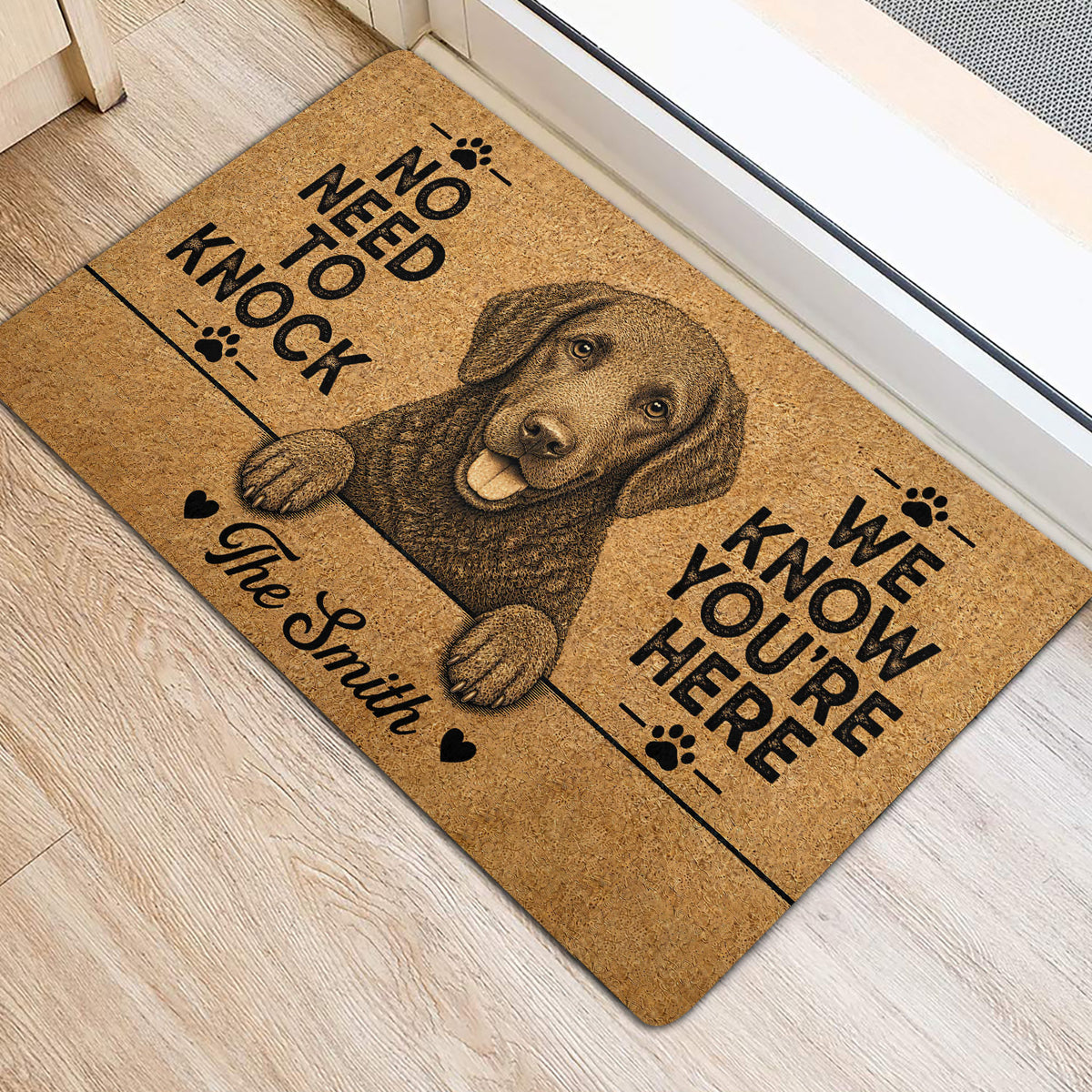 Curly Coated Retriever entryway rug displayed beside a door with a detailed dog portrait and paw print accents