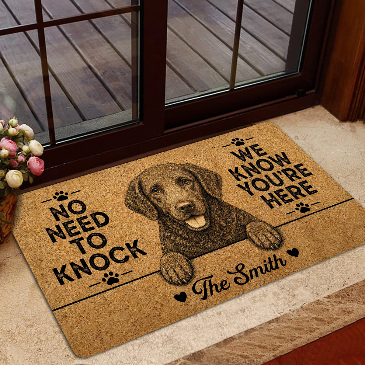 Curly Coated Retriever doormat shown in a home entrance with warm wood trim, glass doors and floral decor