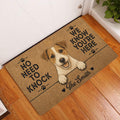 Jack Russell terrier entryway doormat displayed beside a white door on a hardwood floor