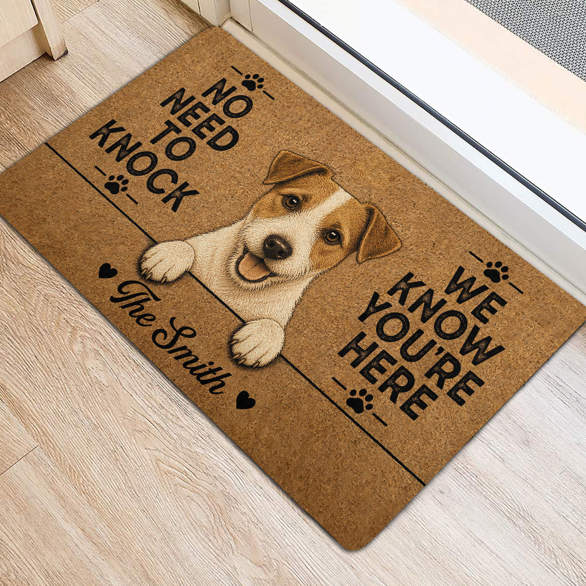Jack Russell dog door mat placed at an entryway, featuring warm brown artwork and black lettering