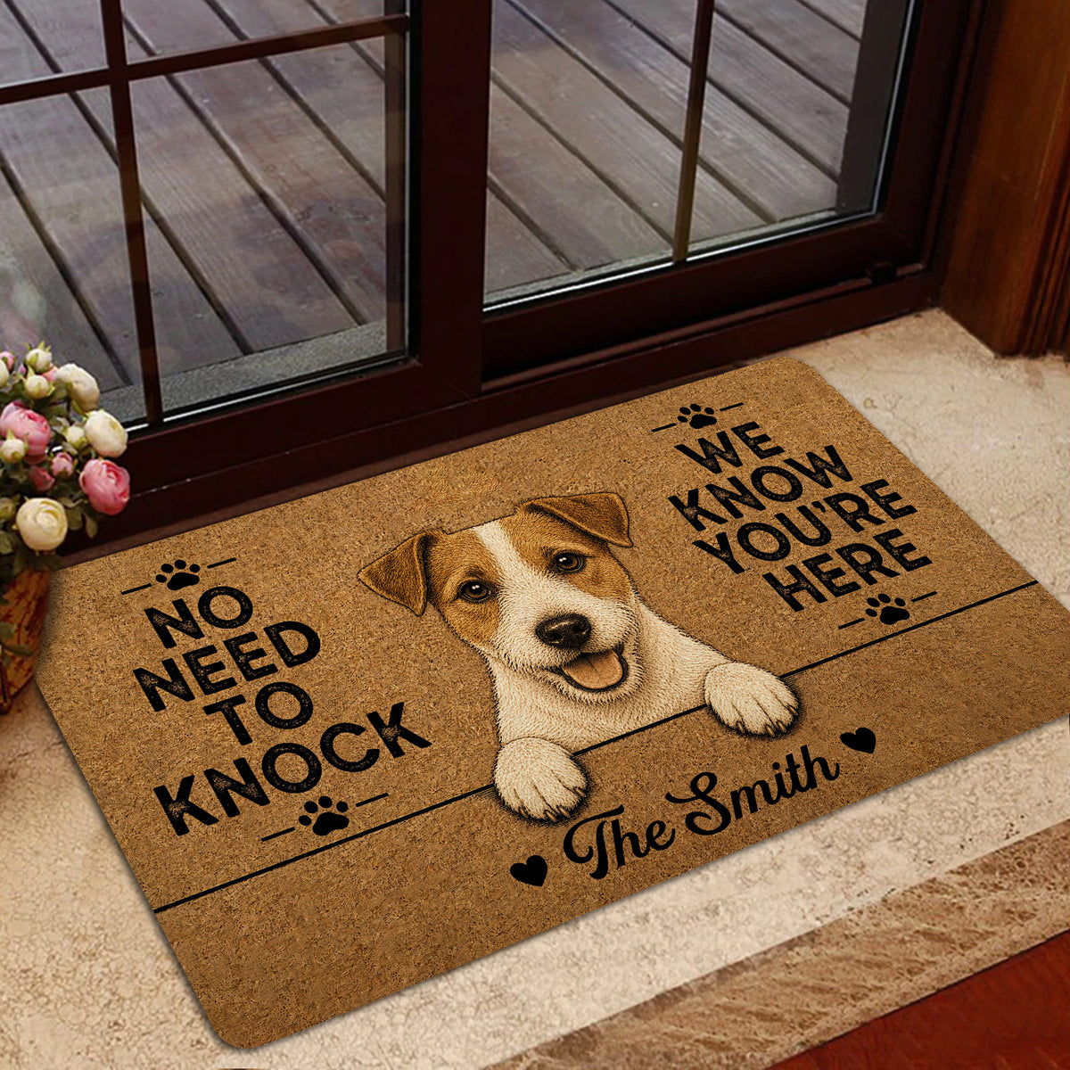 Jack Russell welcome mat styled inside a home entrance near a glass door and indoor plants
