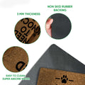 Close-up feature view of the Labradoodle doormat surface, thickness, and dark backing