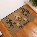 Labradoodle entryway mat displayed beside a white door on a warm wood floor