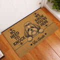 Shih Tzu doormat displayed at an indoor entryway beside a white door and wood flooring