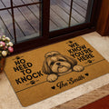Shih Tzu doormat styled near a glass door with warm brown artwork and a welcoming dog theme