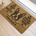 Boston Terrier door mat positioned by an entrance, featuring a playful dog illustration, paw prints, and bold lettering