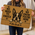 Boston Terrier doormat held indoors, showing the expressive dog illustration, paw prints, and bold black entryway message