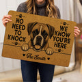 Person holding a tan Boxer dog doormat featuring paw prints, hearts and detailed dog artwork