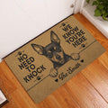 Miniature Pinscher entryway doormat displayed by a white door on a warm wood floor