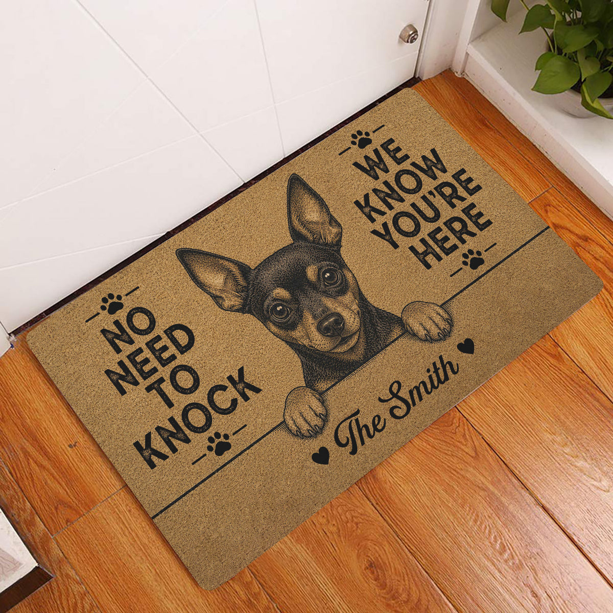 Miniature Pinscher entryway doormat displayed by a white door on a warm wood floor