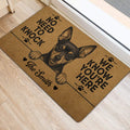 Miniature Pinscher door mat styled at an entryway with black artwork and paw print accents