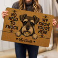 Person holding a tan Miniature Schnauzer doormat featuring a detailed dog portrait and paw print accents