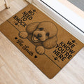 Poodle door mat positioned beside a doorway on light wood flooring with playful paw-print artwork