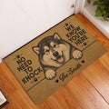 Alaskan Malamute entryway rug displayed beside a white door on a warm wood floor
