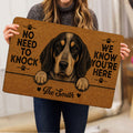 Person holding a Bluetick Coonhound doormat featuring a detailed dog portrait and paw-print artwork