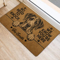 Great Dane entryway mat beside a door featuring a brown and black dog portrait design