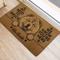 Fluffy Chow Chow door mat placed by an interior doorway with paw prints and bold black lettering