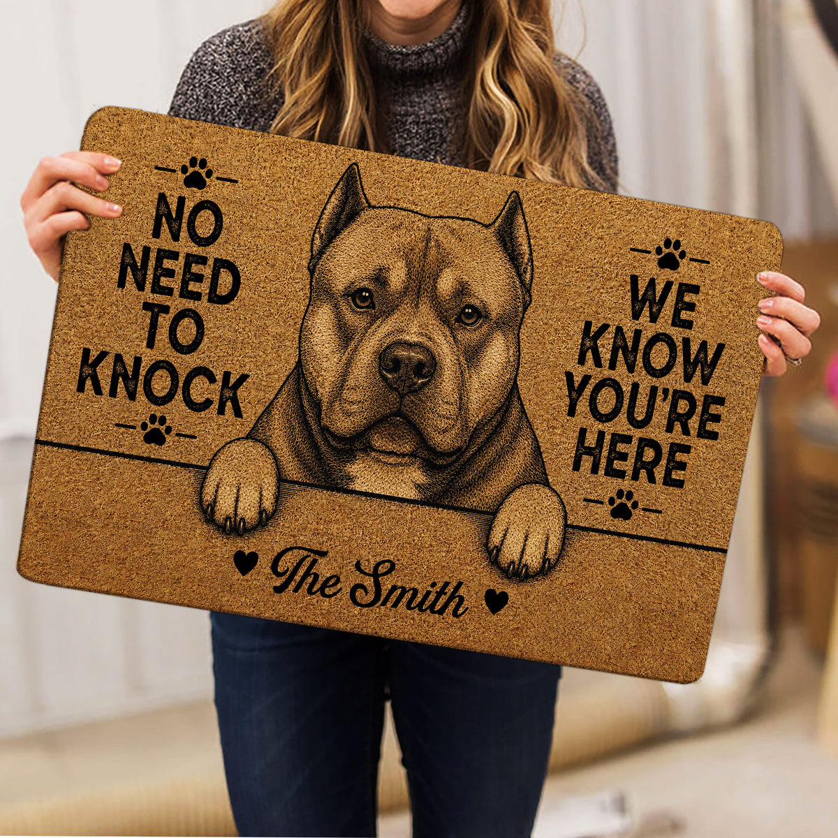 American Bully doormat held indoors, displaying a detailed dog portrait, paw prints and bold black typography