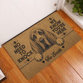 Bloodhound entryway doormat displayed on a hardwood floor beside a white door