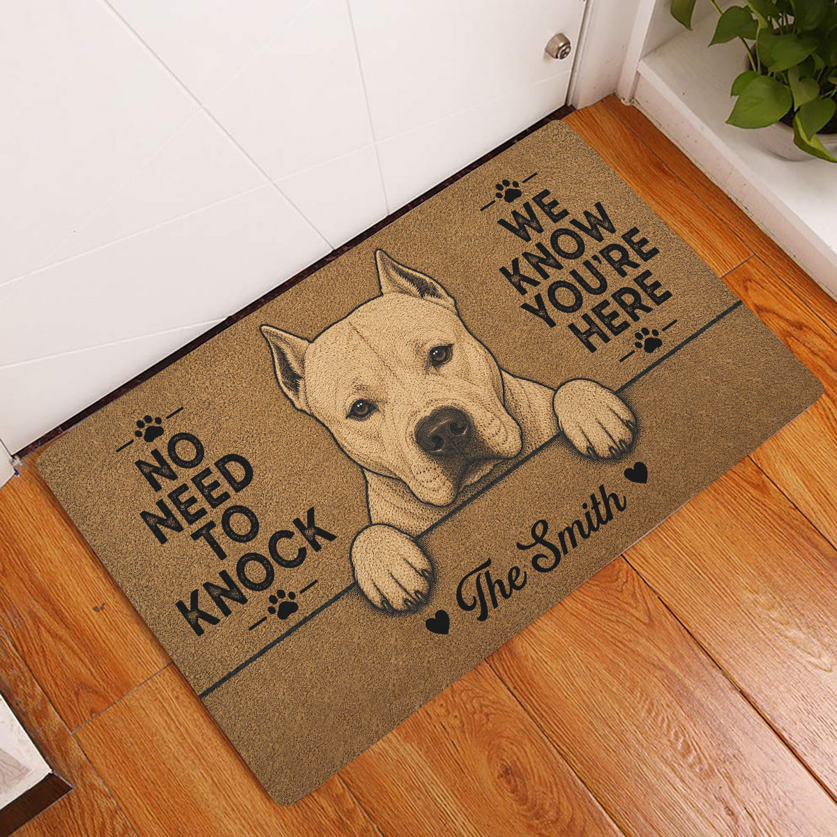 Dogo Argentino doormat styled at a home entrance on hardwood flooring with a white dog portrait