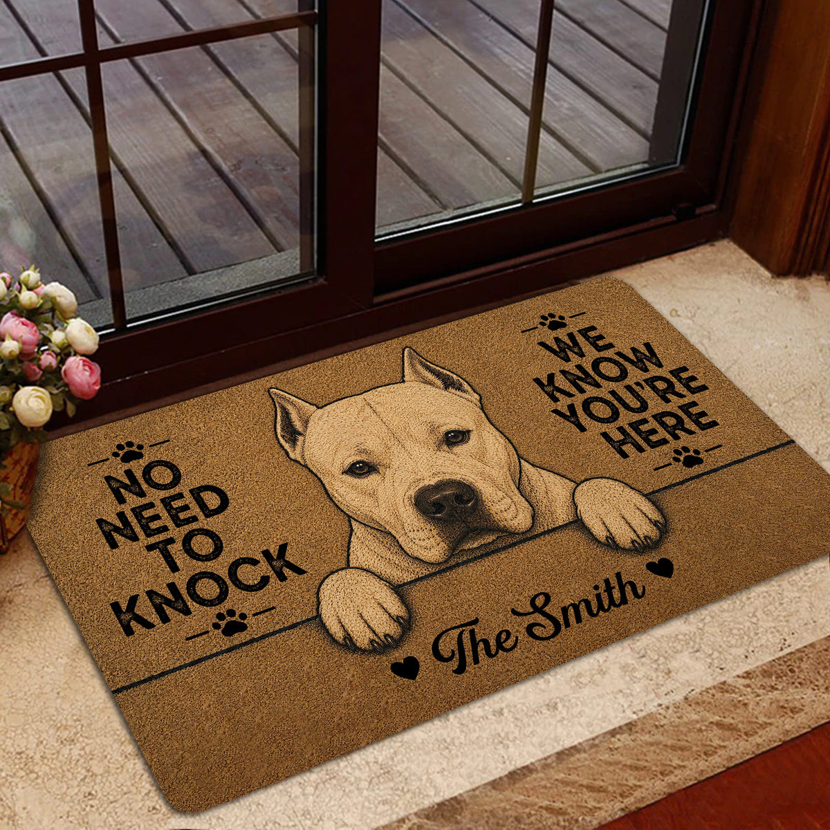 Dogo Argentino entryway rug shown near a glass door with a warm brown dog-themed design