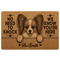 Papillon dog doormat with warm brown artwork, paw prints, and a playful welcome message