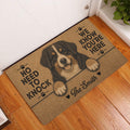Bernese Mountain Dog entryway mat displayed beside a white door on a wood floor