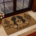 Bernese Mountain Dog welcome mat shown near a glass doorway in a warm home entryway
